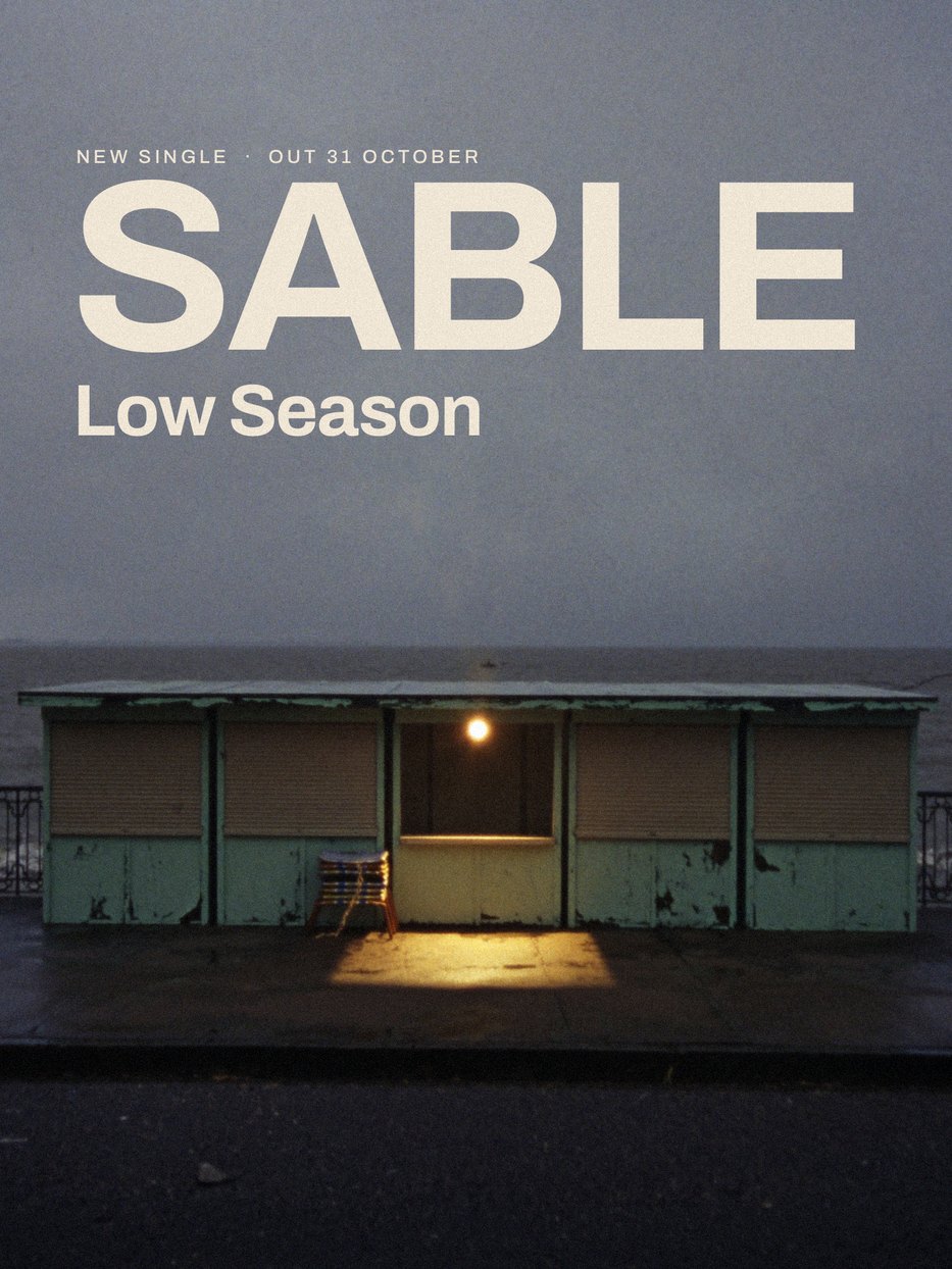 Poster for Sable's new single Low Season: one lit kiosk on a shuttered winter seafront